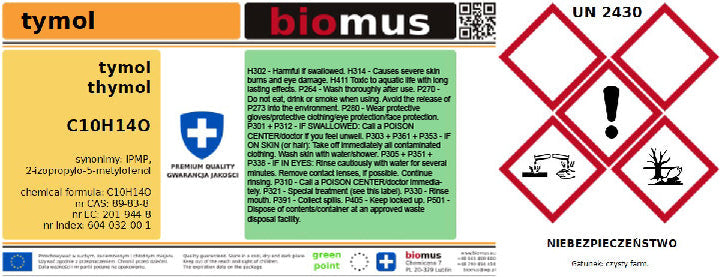 Thymol 50g von BIOMUS, ADR-Produkt in einer weißen Verpackung mit grünem Etikett, liegt auf einem Holzbrett.